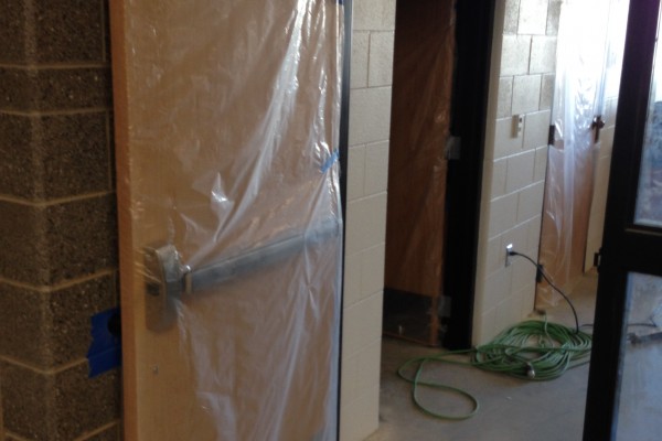 doors and hardware being installed in a classroom